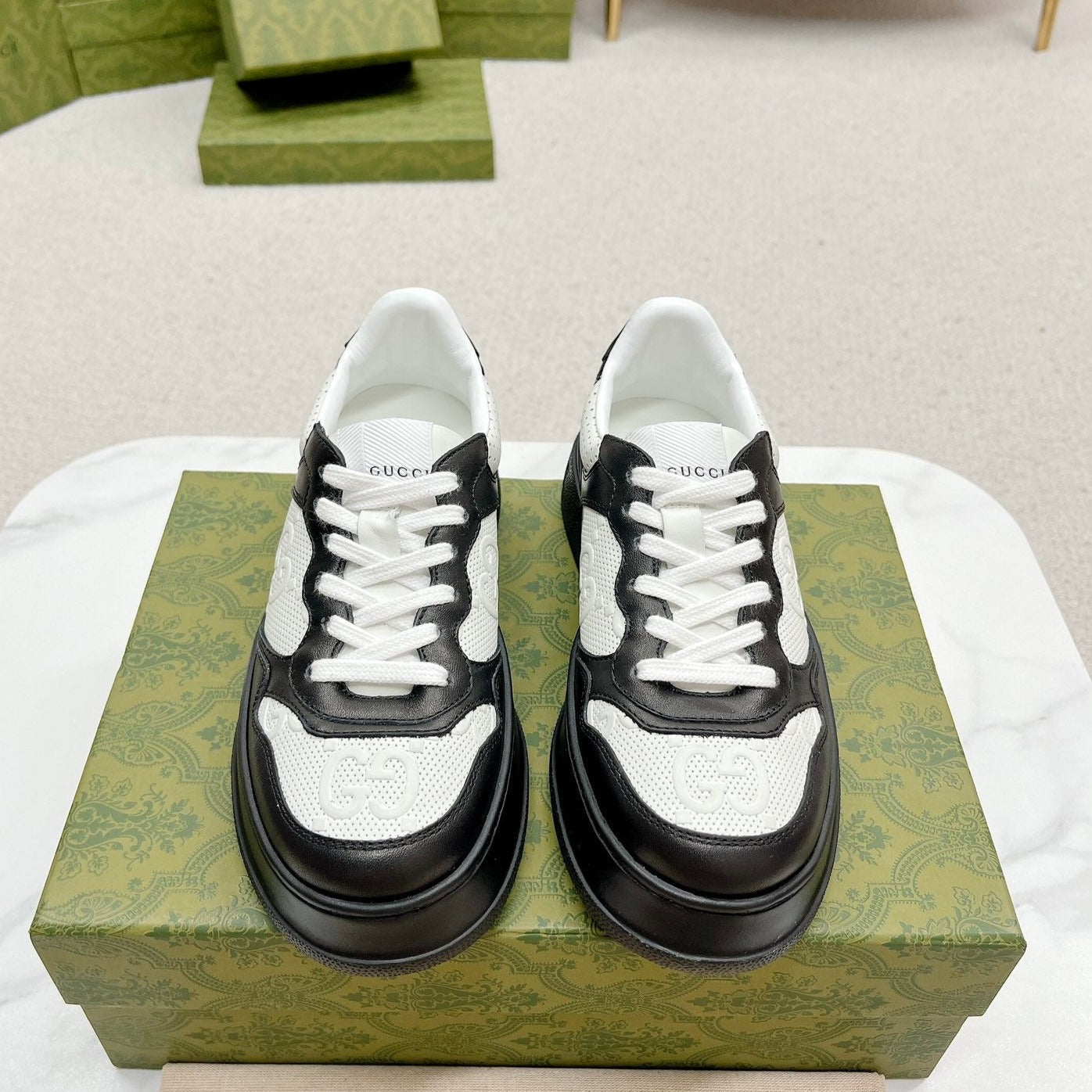 GUCCI EMBOSSED TRAINER BLACK AND WHITE CALFSKIN