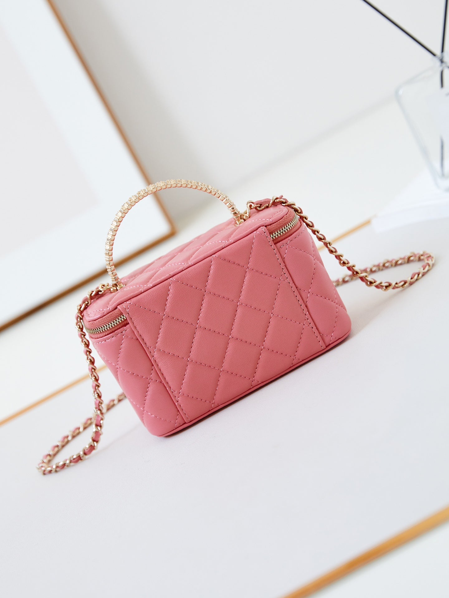 CHANEL 25S MINI VANITY BAG 16 CM IN PEACHY PINK LAMBSKIN WITH CRYSTAL-EMBELLISHED  LOGO